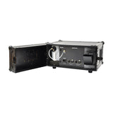 QTX HAZYR-PRO 1000W haze generator in black flight case with door open, showing fluid tank, IEC power inlet, and DMX 3-pin and 5-pin ports.