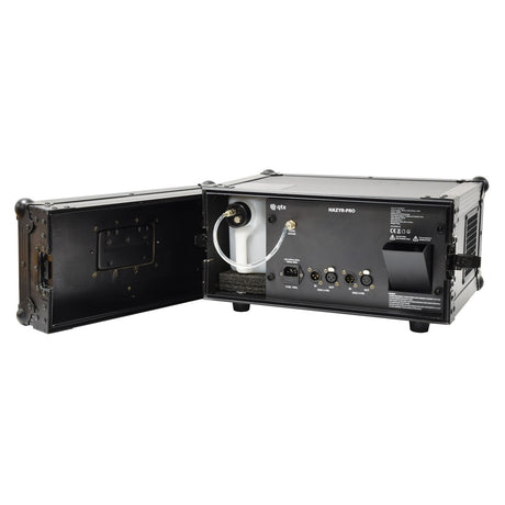 A black, portable QTX HAZYR-PRO Haze Generator - 1000W with an open side panel reveals various input/output ports, cables, and labeled switches. Perfect for flight case storage, its design ensures mobility. The device is placed on a white background.