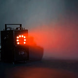 QTX QTFX-LBF2 800W LED bubble and fog machine by AVSL, steel body with front RGB LED panel glowing red through haze on a dark background.
