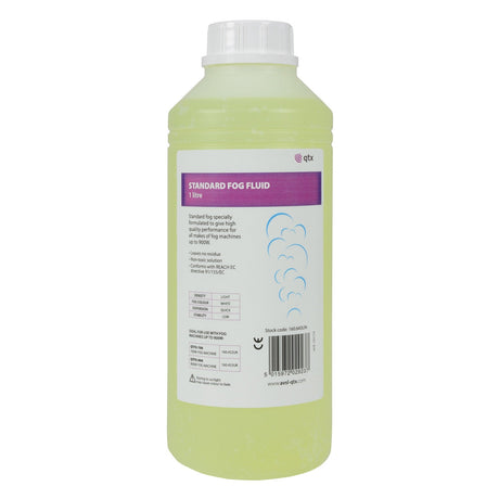 A 1-liter bottle of QTX Standard Fog Fluid Yellow features a white cap. Its purple and white label, adorned with cloud illustrations, emphasizes its water-based formula and provides usage instructions.