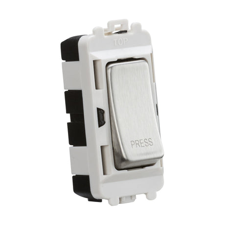 A close-up of the 20AX 2 Way Retractive SP Module in brushed chrome showcases the word “PRESS” on its white and silver button. Its rectangular design, part of the Knightsbridge Grid system, includes a top label and visible black components from the side.