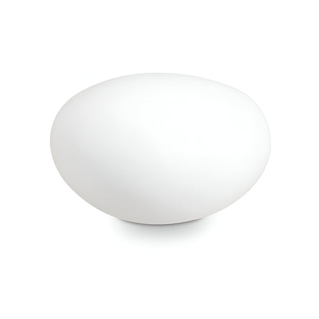 The Zest Outdoor Pedestal Light in White, measuring 25cm, features a sleek opal plastic diffuser that elegantly complements a plain white background, resembling an oval-shaped stone.