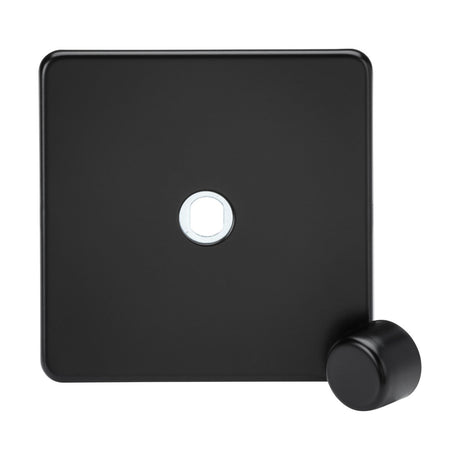 The 1 Gang Dimmer Plate with Matching Metal Dimmer Cap in Matt Black showcases a minimalist, square design with a sleek, screwless finish. It features a small circular button near the bottom right and has a recessed circular area in the center.