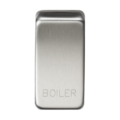 The product is a Switch Cover "Marked BOILER" with a sleek, brushed chrome texture. It features the word "BOILER" engraved in capital letters near the bottom and has a rectangular shape with rounded edges reminiscent of rocker covers.