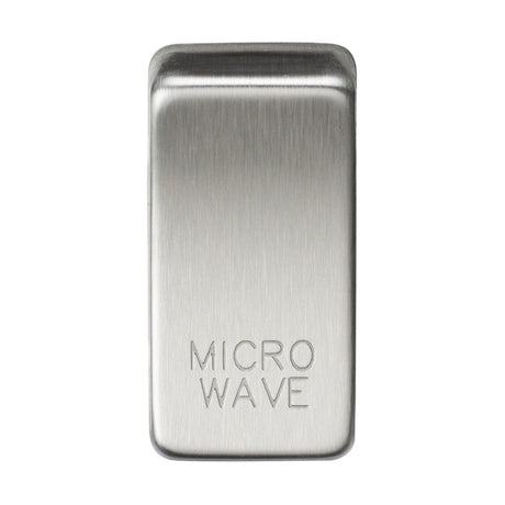 A rectangular metal switch cover in brushed chrome, engraved with "MICROWAVE," offers a blend of style and functionality.