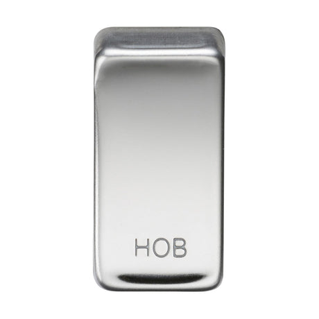 The product is a Switch Cover "Marked HOB" - Polished Chrome, featuring a shiny, rectangular design with rounded edges and embossed with the letters HOB at the bottom center. It boasts a reflective metallic finish similar to rocker covers.