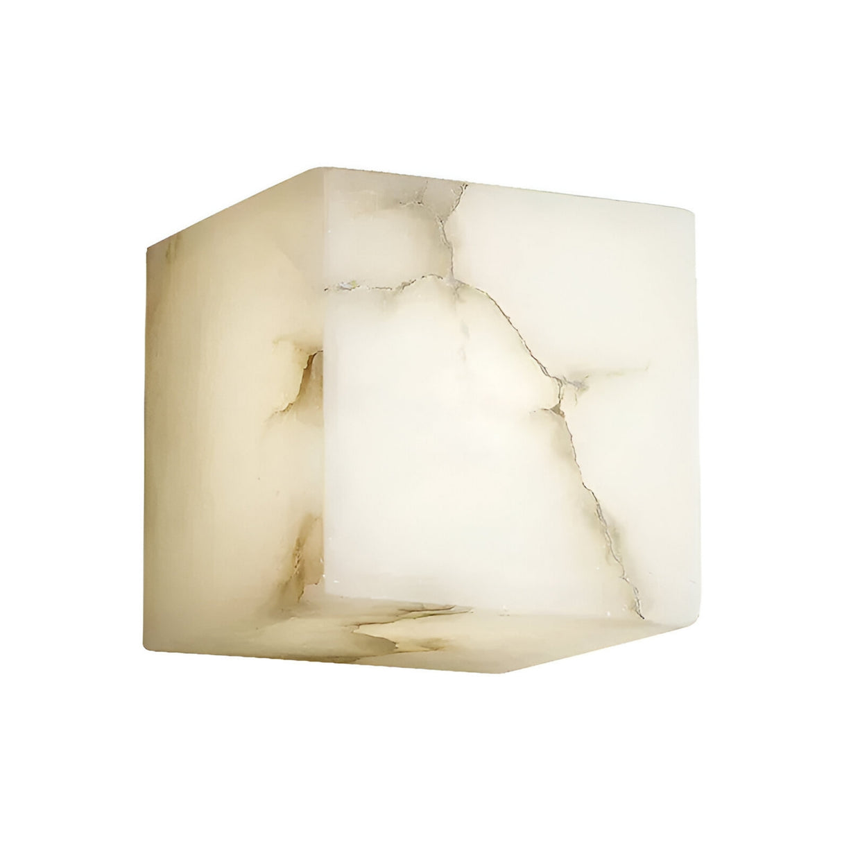 The Calmora 1 Light Block Alabaster Wall Light - Soft White is a cube-shaped fixture crafted from natural Spanish alabaster, showcasing translucent surfaces with gentle brownish veins and cracks against a white background.