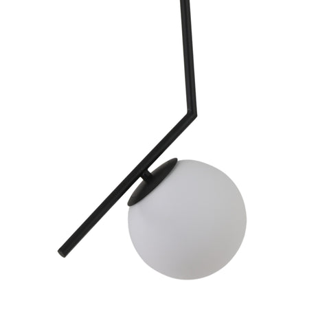 The Vetra Opal Glass Small Pendant Light - Black showcases a modern minimalist design with a black angular metal rod suspending a round opal glass globe at an angle, set against a plain white background.
