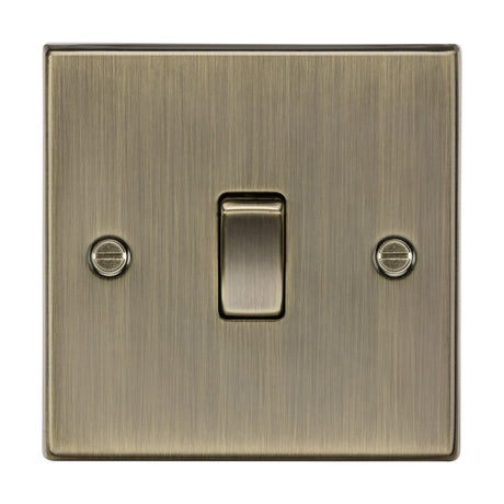 The 10AX 1 Gang 2-Way Plate Switch in antique brass features a square design with a central toggle, brushed metal finish, and comes with two side screws for mounting.