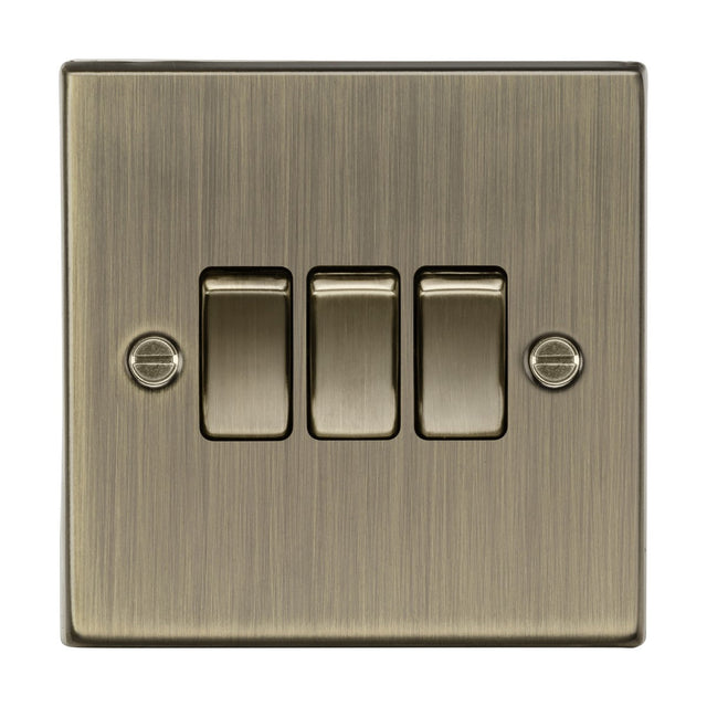 A 10AX 3 Gang 2-Way Plate Switch in square edge antique brass, with three toggle switches and two securing screws, offering a perfect blend of classic elegance for a modern home.