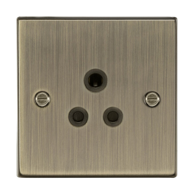 The 5A Unswitched Socket in Antique Brass with a Black Insert features a brushed metal finish with a vintage design. It includes a central grounding pinhole, two smaller pinholes below it, and is equipped with screws on either side for secure mounting. The streaky texture on the surface enhances its classic appearance.