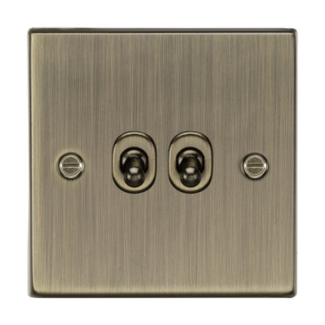 The 10AX 2 Gang 2-Way Toggle Switch features an antique brass square edge design with two vintage-style toggle switches, and visible screws on either side.