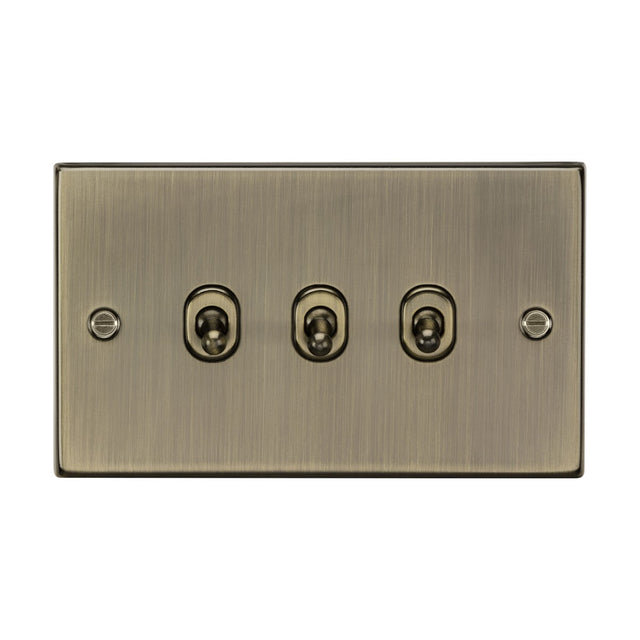 An antique brass flat plate switch panel with three 10AX toggle switches, featuring a brushed bronze finish and two visible screws on each side.