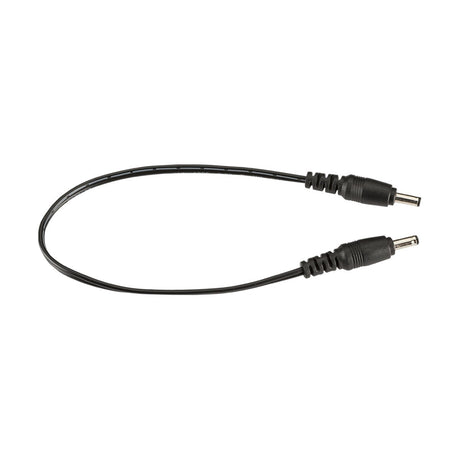 A 12/24V DC Linking Power Lead for LED Striplights, measuring 25cm in length, is displayed against a white background. Featuring two cylindrical connectors at each end, the slightly curved cable clearly showcases both connector tips, making it perfect for connecting striplights powered at 12/24V.