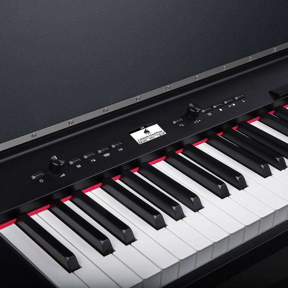 Close-up of the NU-X NCK-330 88-note weighted digital upright piano by AVSL, showing the black control panel, display, dial and weighted keys.