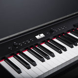 Close-up of the NU-X NCK-330 88-note weighted digital upright piano by AVSL, showing the black control panel, display, dial and weighted keys.