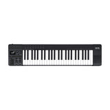 NU-X NTK-49 semi-weighted 49-key MIDI keyboard controller in black with sliders, rotary knobs, display, pitch and mod wheels, and track pad, on white.