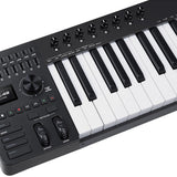 Close-up of the NU-X NTK-49 semi-weighted MIDI keyboard controller by AVSL, showing rotary knobs, sliders, display, transport keys, pitch and mod wheels.