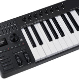 Close-up of the NU-X NTK-61 semi-weighted 61-key MIDI keyboard showing rotary knobs, sliders, display, transport buttons, pitch and mod wheels.