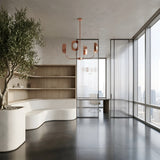 Minimalist office with large windows, city views, curved white bench, wooden shelves, potted tree, black tile floors, glass partitions, and a striking Petal 4 Light Chandelier - Copper as the modern centerpiece.