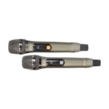 QTX J-MIC dual UHF handheld wireless microphones with metal mesh grilles, digital channel displays and grey bodies, shown on a plain white background.