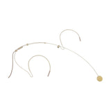 Chord FNM-35 discreet beige neckband headset microphone with over-ear supports, boom arm and foam-covered capsule, shown on a plain white background.