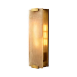 The Virelux LED Faceted Stone Alabaster Wall Light features a rectangular frosted Spanish alabaster shade with brass accents, providing a warm, soft white glow.