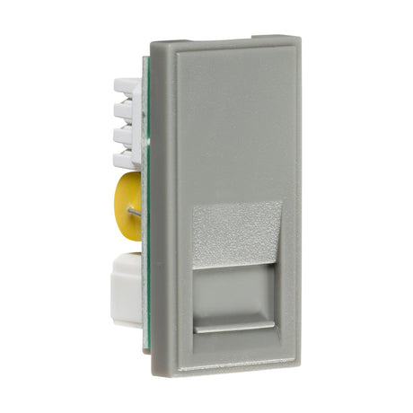 A gray, rectangular electrical component known as the Telephone Master Outlet Module 25 X 50mm (IDC) features a yellow circular element and white connectors on one side, similar to euro-module faceplates with a slightly textured surface, reminiscent of a Master BT outlet, set against a white background.