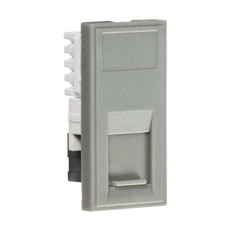 A close-up of the UTP CAT5e RJ45 Outlet Module 25 X 50mm in gray, featuring an empty port for network or phone jacks. Designed for wall mounting, the rectangular surface smoothly accommodates an RJ45 socket, making it ideal for UTP CAT5e connections.