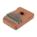 Chord KALIMBA-O17C 17-key thumb piano with carved okoume wood body, decorative rosette sound hole, and numbered metal tines, on a white background.