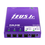 NU-X Zeus Jr. Isolated Pedal Power Supply in purple metal casing with six DC outputs, five green status LEDs, and voltage selector switches.
