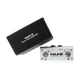 NU-X NMP-2 dual foot controller switch pedal in silver metal housing with A and B footswitches, shown beside its black product box on a white background.