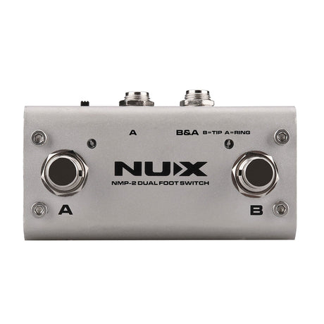 Image of the NU-X NMP-2 Dual Foot Controller in silver, perfect for managing guitar effects. It includes buttons A and B, along with two input/output jacks at the top, ideal for connecting instruments. This versatile foot switch controller is designed to seamlessly manage musical effects.