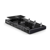 NU-X MG-30 multi-effects modeller pedal in matte black, angled view showing expression pedal, footswitches, rotary controls, jacks, USB-C port and power switch.