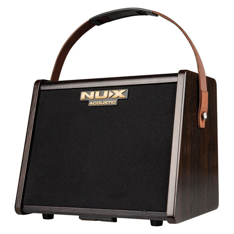 The NU-X AC-25 Acoustic Guitar Amplifier features a wooden casing with a black front panel and a brown leather strap handle for easy transport. It supports seamless use with acoustic instruments and offers Bluetooth audio streaming for enhanced versatility.