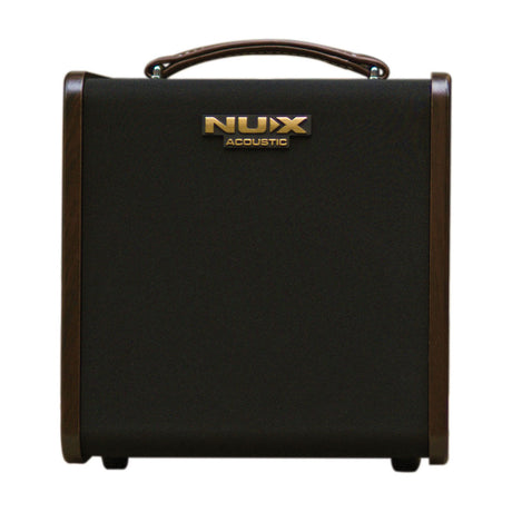 NU-X Stageman II AC-80 rechargeable acoustic amp with black grille, gold badge, wood side panels and brown handle on white background.