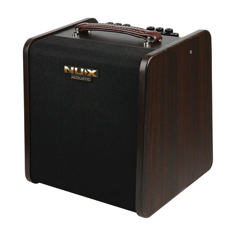 NU-X Stageman II AC-80 rechargeable acoustic amplifier with dark wood cabinet, black speaker grille, leather top handle and top-panel controls.