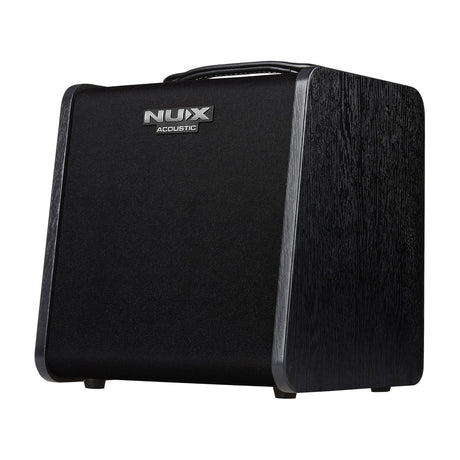 NU-X Stageman II AC-60 acoustic guitar and vocal amplifier with black woodgrain cabinet, angled front grille, top handle and logo badge.