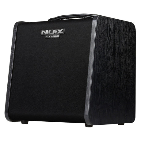The NU-X Stageman II AC-60 Acoustic Amplifier is a black amplifier with a sleek, modern design. It includes a sturdy handle on top and a textured finish. The brand's logo is prominently displayed on the front, and it supports Bluetooth audio streaming for versatile connectivity.