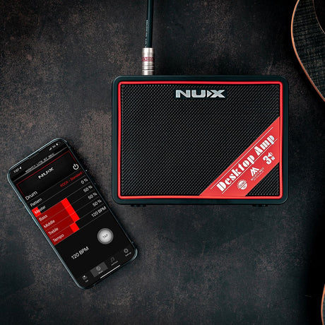 NU-X Mighty Lite BT mkII Bluetooth Guitar Amp in black with red trim, shown beside a smartphone displaying the Mighty Amp control app.