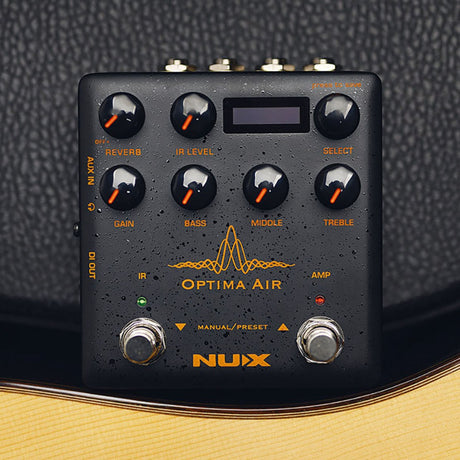 NU-X Optima Air Acoustic Simulator and IR Loader Pedal in matte black with orange labelling, seven control knobs, display, two footswitches and side jacks.