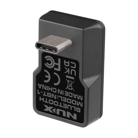NU-X NBT-1 Bluetooth adaptor for Mighty 20 mkII guitar amp, small black USB-C dongle with certification label, shown on a white background.