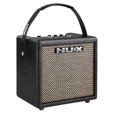 The NU-X Mighty 8BT Guitar Amp is a black portable amplifier that includes a textured finish and a compact handle on top. The front panel boasts a speaker grille prominently featuring the brand name, and it allows for portable use with multiple control knobs on the top for various adjustments.