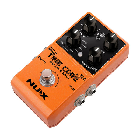 NU-X Time Core Deluxe mkII digital delay pedal in orange with four black control knobs, mode selector, footswitch and 6.35mm jacks.