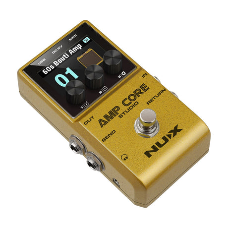 NU-X NCA-1 Amp Core Studio pedal in gold finish, shown at an angle with colour display, three rotary knobs, footswitch, and side jack sockets.