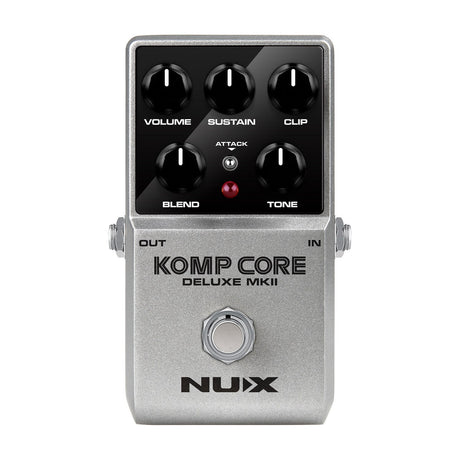 NU-X NCC-2 Komp Core Deluxe mkII compressor pedal in silver casing with Volume, Sustain, Clip, Blend, Tone knobs and Attack switch on white.
