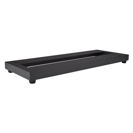 The Chord Micro Pedal Board With Bag features a rectangular, black metal design with four small feet that provide slight elevation, making it perfect for showcasing pedal platforms or organizing guitar effect pedals. Its open center and smooth finish combine style with function, ideal for display or organizational use.