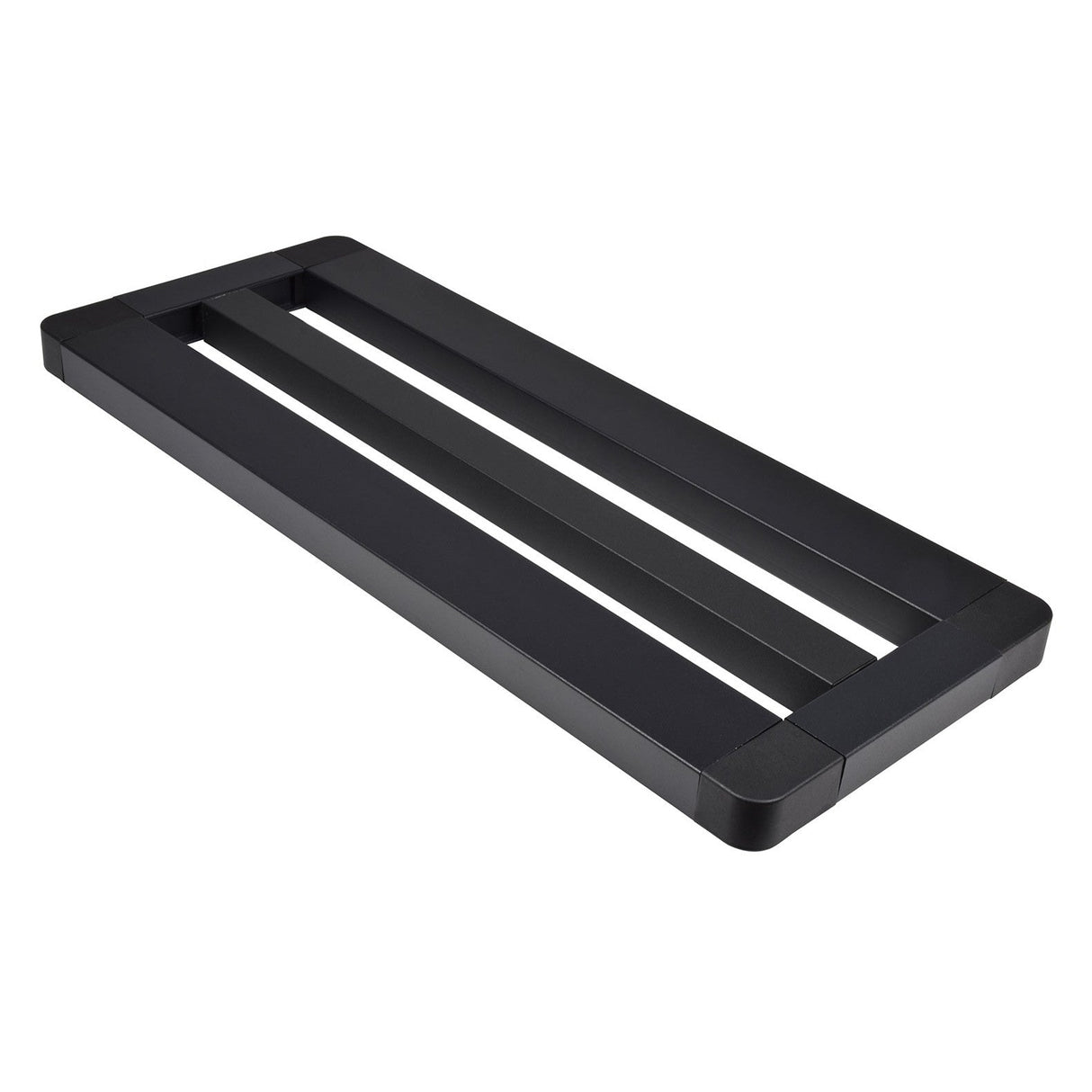 A black, rectangular metal frame described as the Chord Mini Pedal Board With Bag, featuring two open slots and a minimalist modern design. With non-slip feet and rounded corners, this board serves as a sturdy base or support, making it ideal for use as a table base or monitor stand.