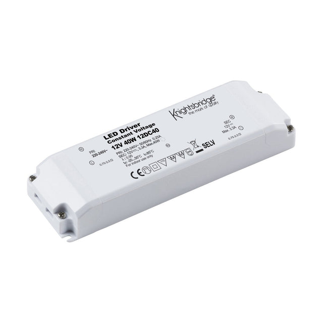 The Knightsbridge 40W Constant Voltage LED Driver in white offers overload protection and a rectangular design, featuring two connection points on each end. It displays specifications such as 12V, 40W, and 120°C40, along with model details and safety certifications.