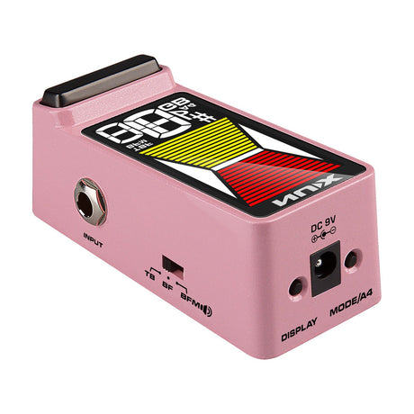 NU-X NTU-3 Flow Tune mini pedal tuner in pink with HD colour display, 6.35mm input jack, TB/BF/BFM mode switch, DC 9V port, and Display and Mode/A4 buttons.